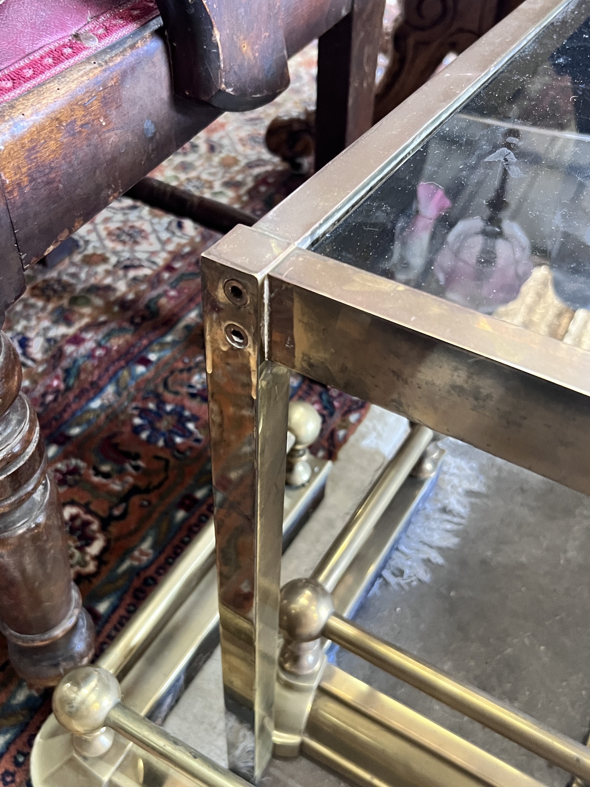 A mid century rectangular brass and smoked glass coffee table, length 135cm, depth 70cm, height 47cm